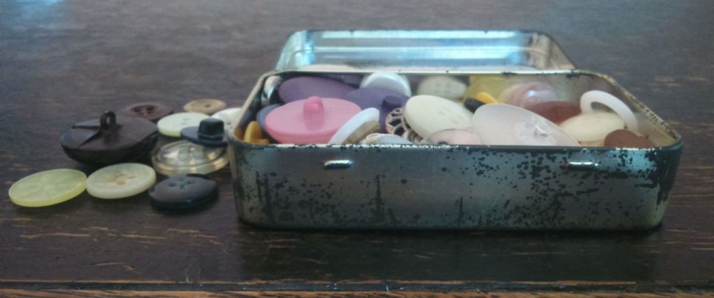 Demise of the local haberdashery; buttons in an old tin