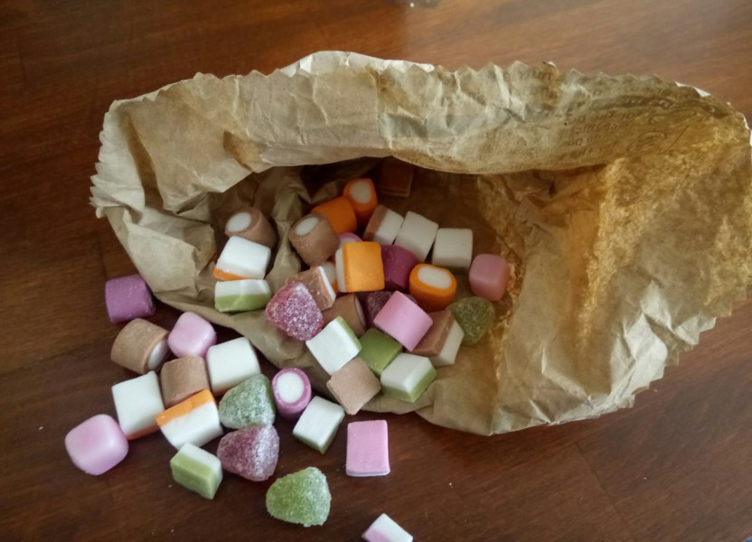 Plastic-free food shopping: Image of Dolly Mixture sweets in a paper bag bought from a shopkeeper-serve counter