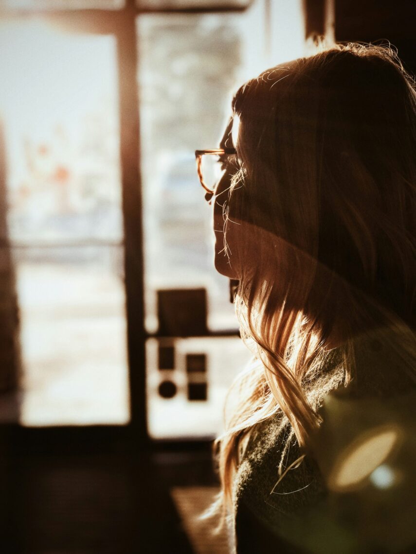 Truth Seeker; Prospector: shallow focus photography of woman facing door