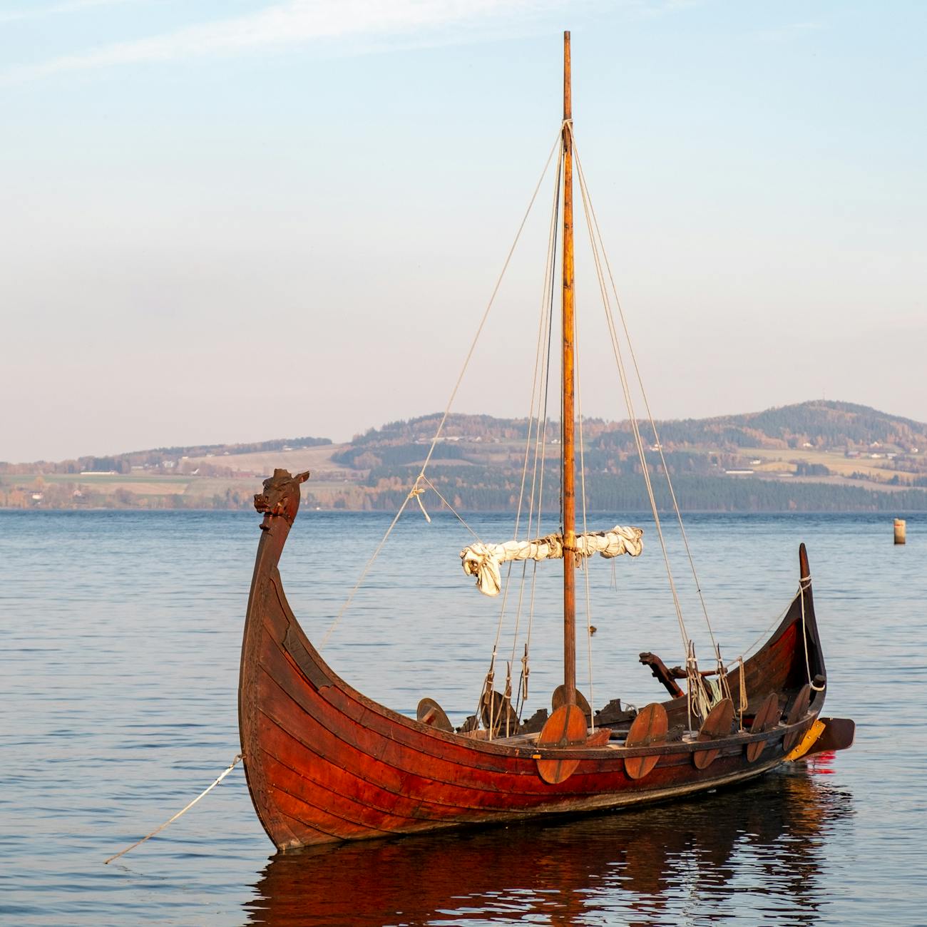 photograph of a brown wooden sailboat